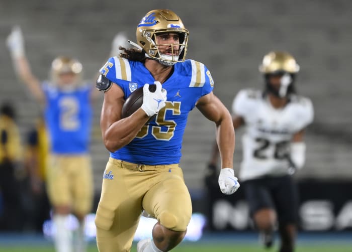 Nov 13, 2021; Pasadena, California, USA; UCLA Bruins tight end Greg Dulcich (85) runs with the ball for a first down in the first half against the Colorado Buffaloes at Rose Bowl. Mandatory Credit: Jayne Kamin-Oncea-USA TODAY Sports