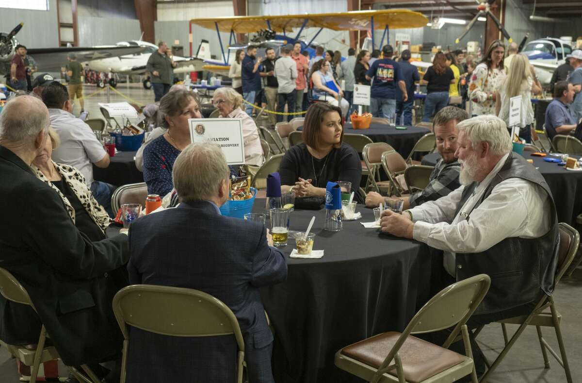 Beer lovers enjoy a night of tasting 04/06/19 at the High Sky Wing of the CAF Hops & Props fundraiser in the High Sky Wing hanger. Tim Fischer/Reporter-Telegram