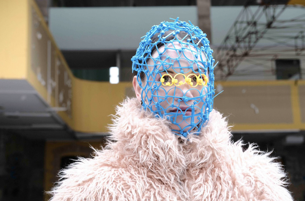 At the beginning of the war, Polina Veller, an artist and designer from Kyiv, made masks out of yellow and blue plastic cable ties. They look like strange veils.