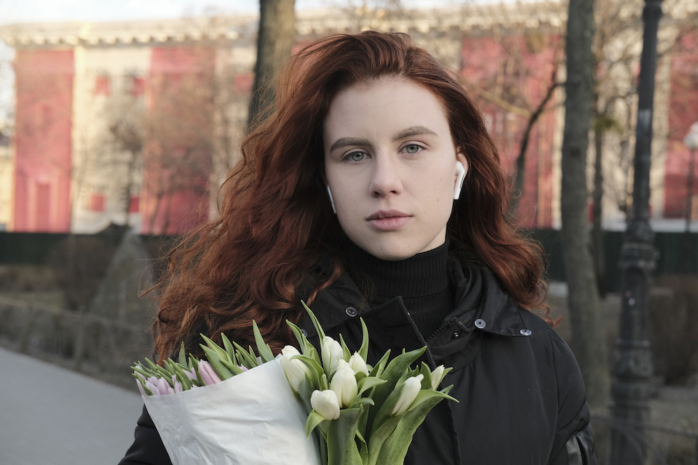 In the evening I met Lisa, a designer. A flower shop was giving away bouquets; Lisa had taken two and wanted to give one to somebody.